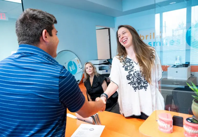 patient smiling during her visit to Austin dental office Brilliant Smiles